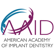 Logo of the American Academy of Implant Dentistry, representing professional affiliation of Wichita Family Dental.